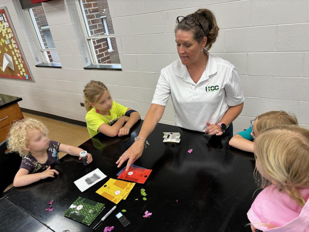 Wendy Hines working with children in lab with colored cards